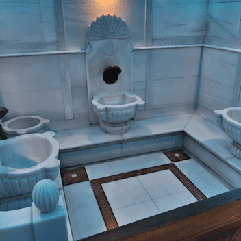 Acemoğlu Hamamı – Geleneksel Yıkanma Alanı Mermer kurna ve geleneksel mimari detaylarla süslenmiş Osmanlı tarzı hamam iç mekanı – Acemoğlu Tarihi Hamam.